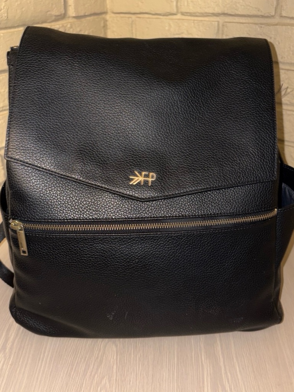 Black Pebbled Leather Backpack with Gold Hardware